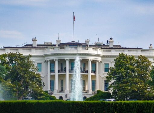 Front facade of white house taken from the front lawn