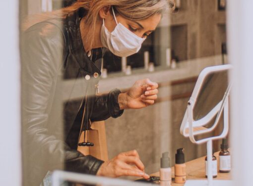 Female small business owner in her store working with her product