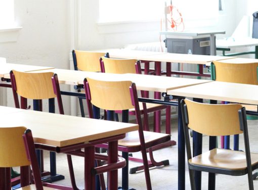Desks and chairs in an empty classroom