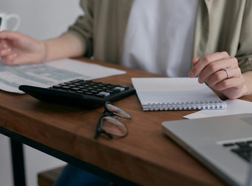 person sitting at desk working on estate plan