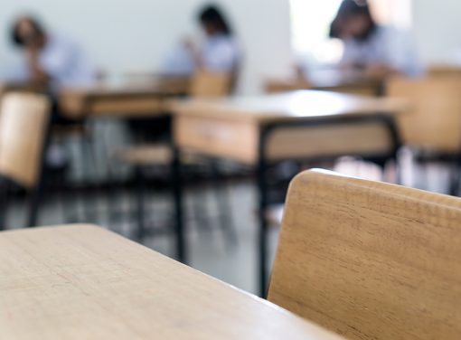 desk with students in the background