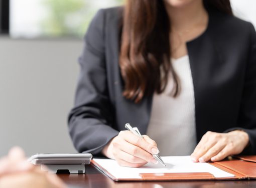 woman looking over documents