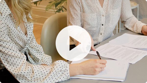 Lawyer going over paperwork with client