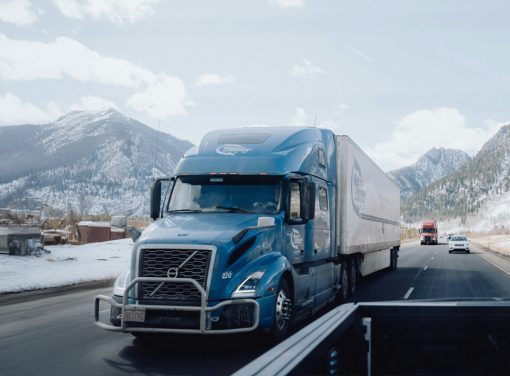 semi truck driving down highway
