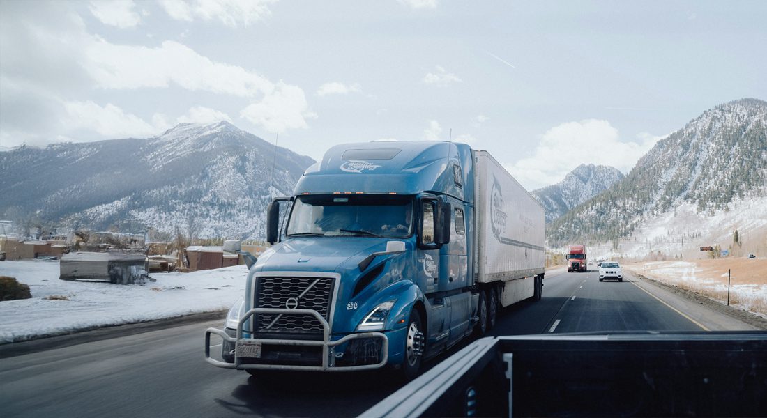 semi truck driving down highway