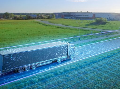 Tractor trailer driving down highway with abstract data design surrounding the trucking