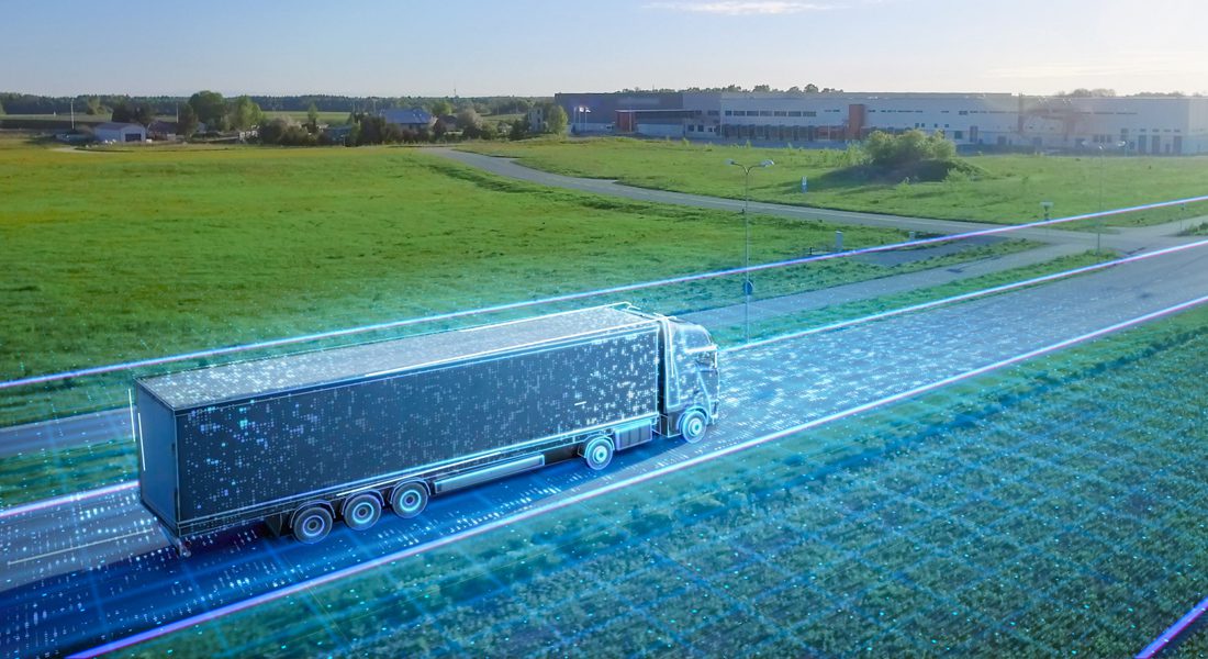 Tractor trailer driving down highway with abstract data design surrounding the trucking