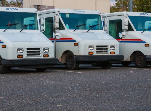 row of USPS trucks