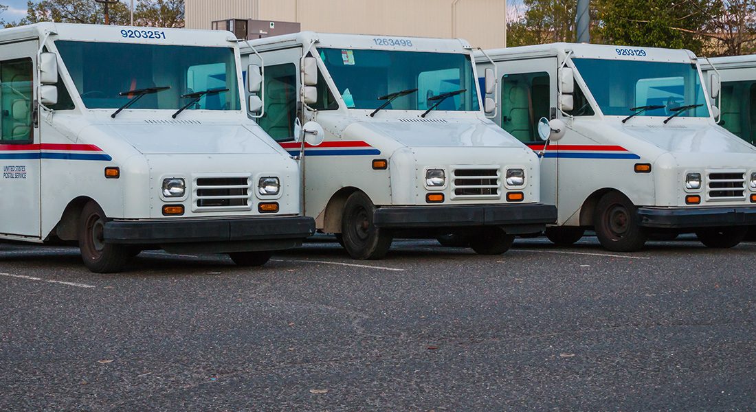 row of USPS trucks