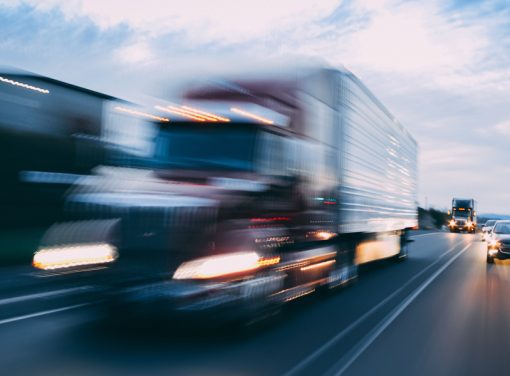 Motion blur of truck driving down highway