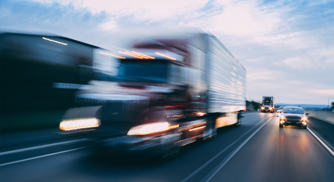 Motion blur of truck driving down highway