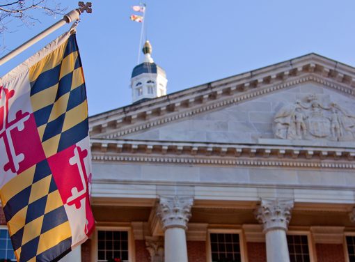 Maryland state flag and capitol bldg