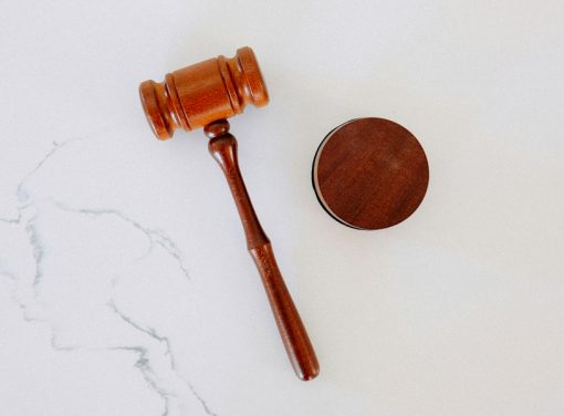 Gavel on white marble tabletop