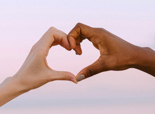 Two hands creating a heart shape