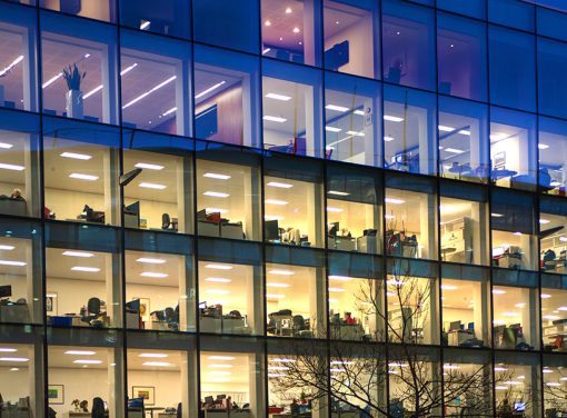 Glass office building at night