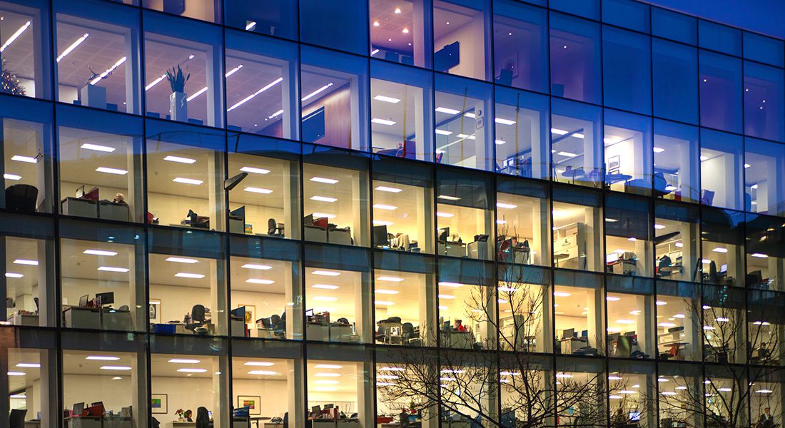 Glass office building at night